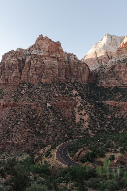 Free photo vertical shot of an empty street and zion national park in the usa