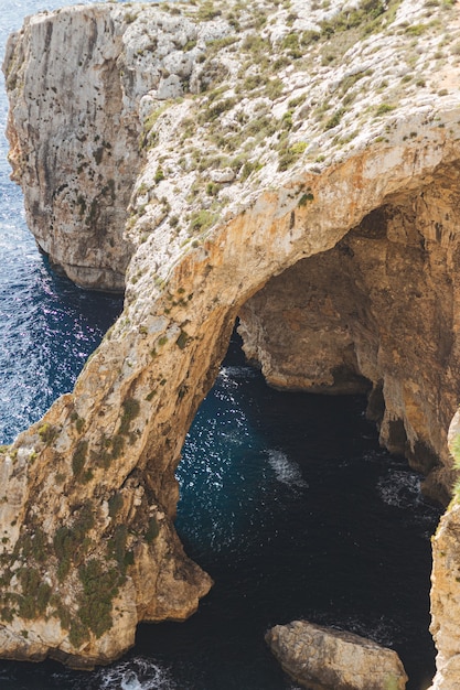 Vertical shot of the famous Blue Wall and Grotto Viewpoint in Malta