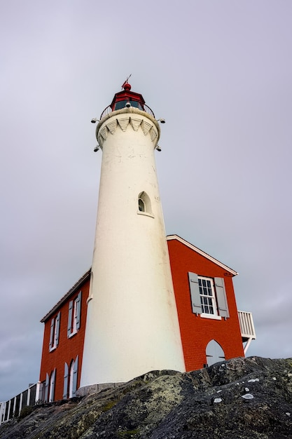 Free Photo vertical shot of fisgard lighthouse and fort rodd hill national historic site, victoria, bc canada