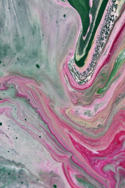 Vertical shot of green pink and white abstract patterns with paints in the water