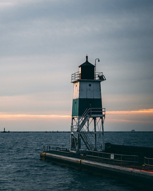 Vertical shot of a lighthouse and a beautiful sunset