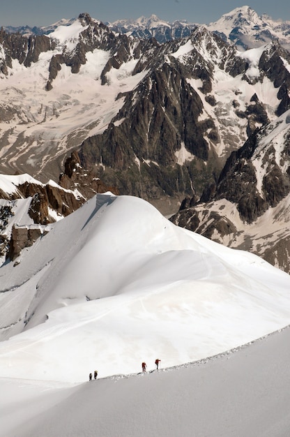 Vertical shot of the magnificent mountain peaks covered with snow