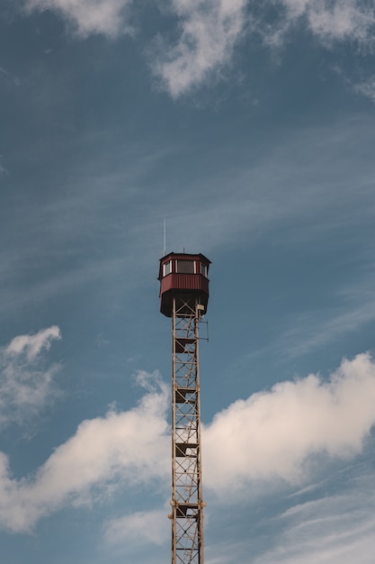 Vertical shot of an observation tower and a blue sky