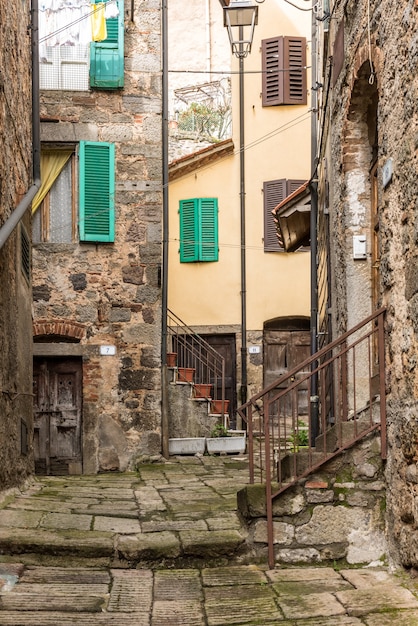 Vertical shot of an old neighborhood with ancient houses and old staircases