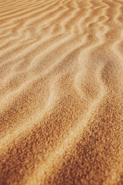 Vertical shot of the patterns on the sands in the desert