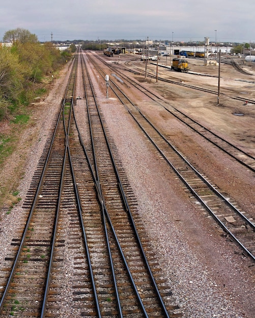 Vertical shot of railraods under the sunlight at daytime