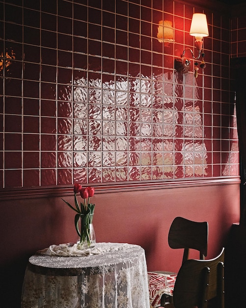 Vertical shot of a red cafe interior with tiled walls