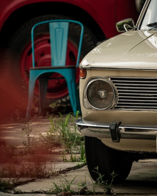 Vertical shot of a retro beige car front