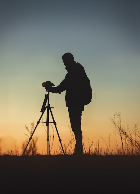 Vertical shot of the silhouette of a man in front of the camera