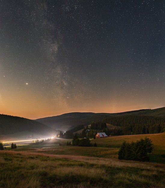 Free Photo vertical shot of a starry night sky with the milky way over the giant mountains