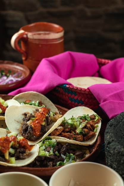 Vertical shot of tasty tortillas with meat and tomato sauce on of ingredients