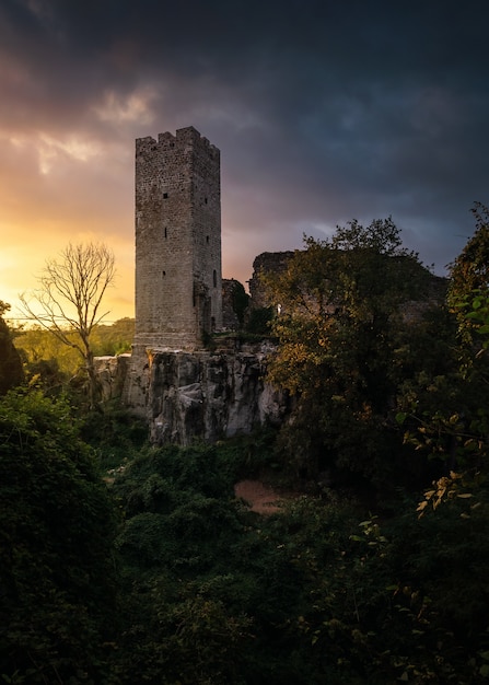 Vertical shot of a tower at Momjan. Croatia at sunset