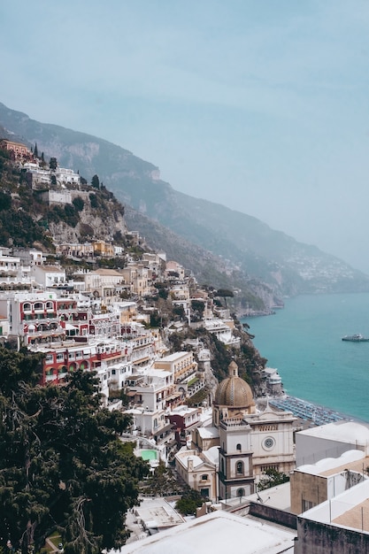 Free Photo vertical shot of the view of positano village in italy near the sea during daylight