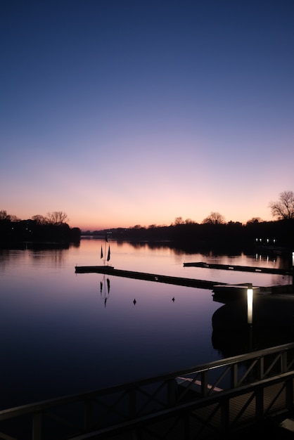 Free Photo vertical view of a calm river under the beautiful clear sky at sunset