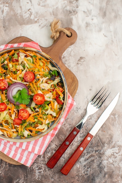 Free Photo vertical view of fresh vegan salad of various organic vegetables