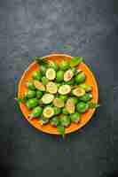 Free photo vertical view of natural fresh green feijoas