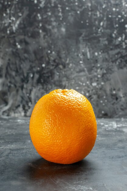 Vertical view of natural organic fresh orange on dark background