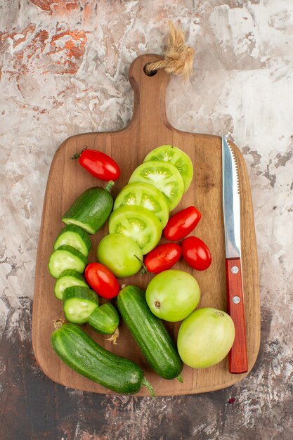 Vertical view of whole and chopped organic vegetables