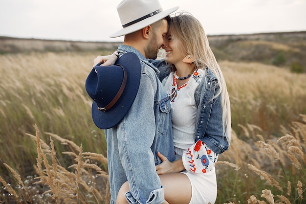 Very beautiful couple in a wheat field