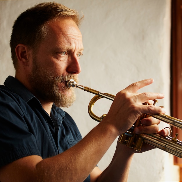 veteran musician playing the trumpet