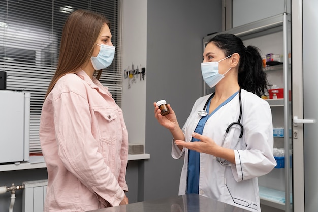 Veterinarian offering client medication for their pet