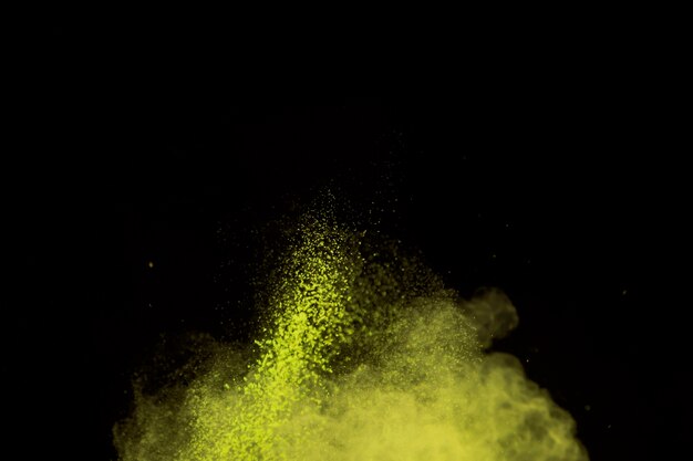 Vibrant burst of makeup powder on dark background