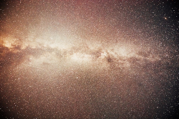 Vibrant night sky with stars and nebula and galaxy.