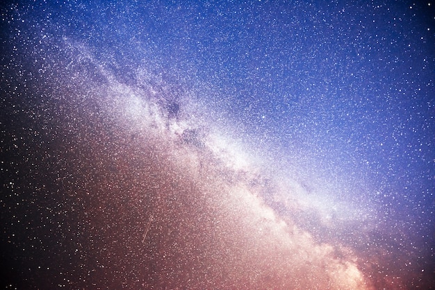 Vibrant night sky with stars and nebula and galaxy.