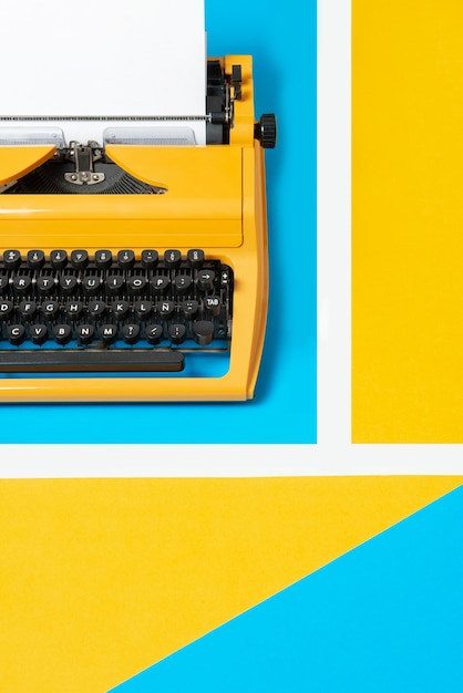 Free photo vibrantly colored retro typewriter with keyboard and buttons