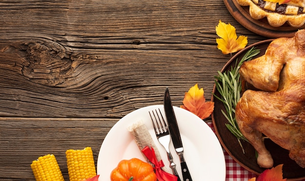 Above view arrangement with delicious meal on wooden background