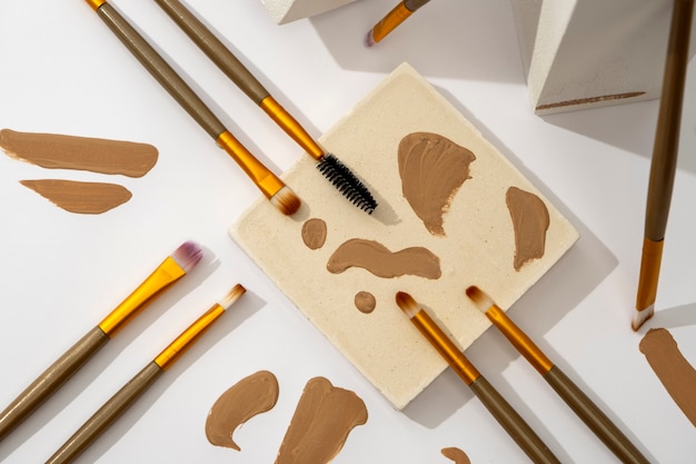 View of assortment of brushes with brown paint