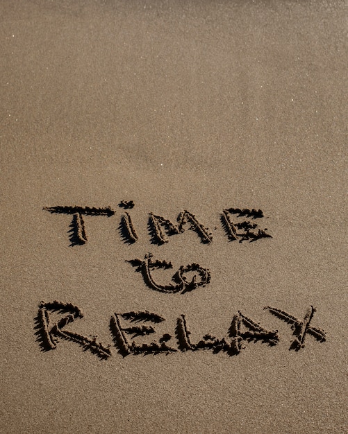 View of beach sand in summertime with message written in it