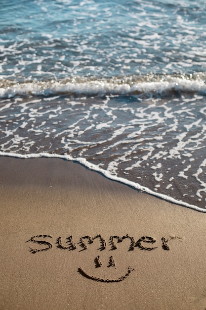 View of beach sand in summertime with message written in it