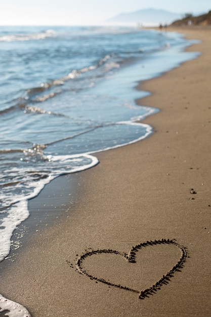 Free photo view of beach sand in summertime with message written in it