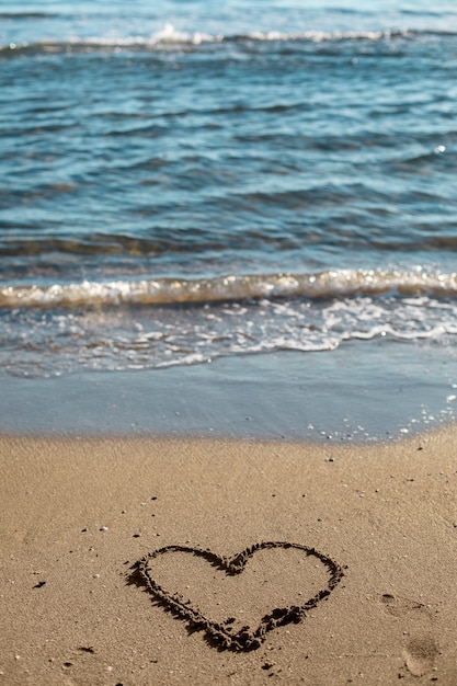 Free photo view of beach sand in summertime with message written in it