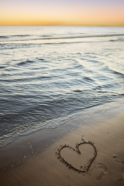 Free photo view of beach sand in summertime with message written in it