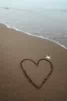 Free photo view of beach sand in summertime with message written in it