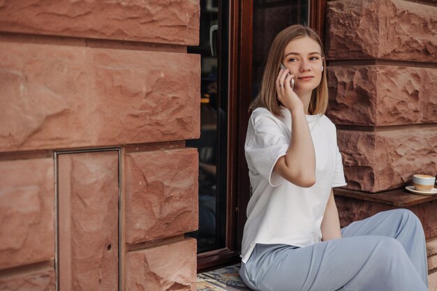 View of beautiful woman look away with phone