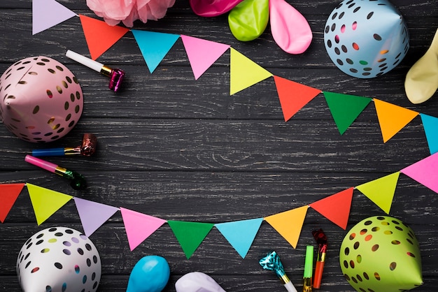 Above view birthday decorations on wooden background