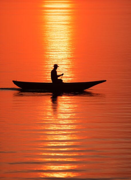 View of boat on water at sunset