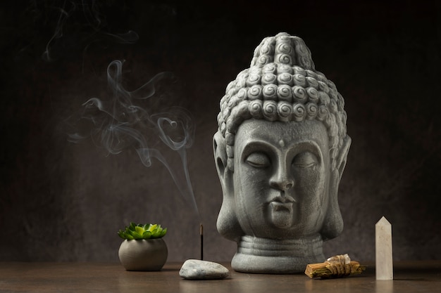 Free Photo view of buddha statuette with incense