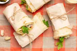 Free photo above view burritos on tablecloth