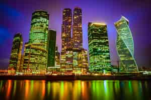 Free photo view of a city with illuminated skyscrapers at night