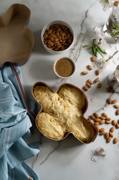 Above view colomba dough and almonds