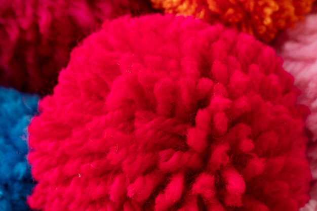 Above view colorful pom poms arrangement