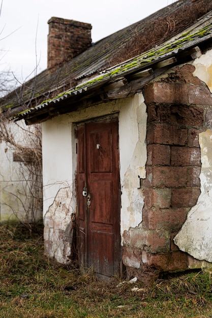 Free photo view of deserted and decaying house in nature