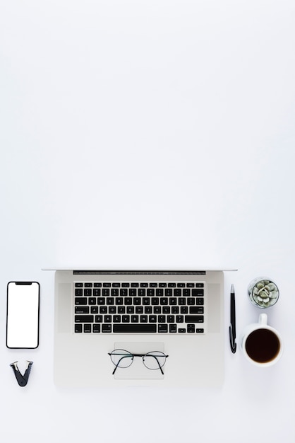 Above view desk arrangement with laptop