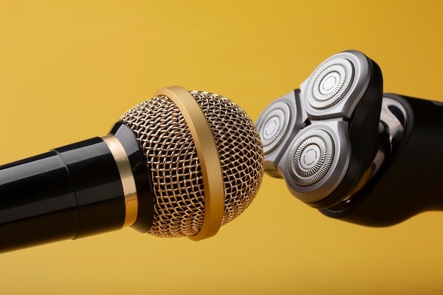 View of electric hair trimmer close to microphone for asmr