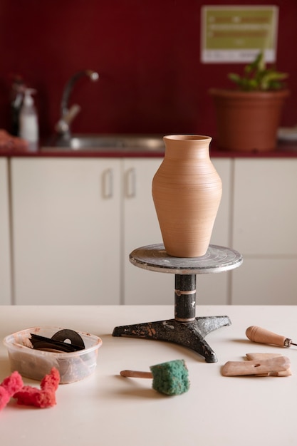 Free photo view of essentials in a pottery studio