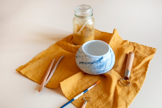 Free photo view of essentials in a pottery studio